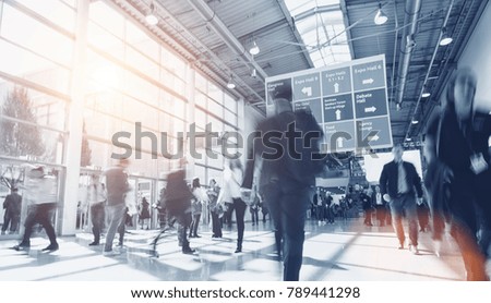 blurred business people in a modern hall