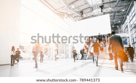 crowd of blurred people at a airport