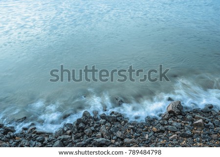 high angle view of the Sea waves splash on stones