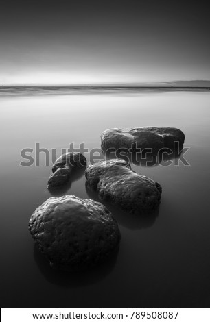 Fine art black & white image of stepping stones near the beach in Pulau Pinang island Malaysia. Soft focus due to long exposure.
