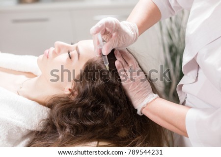 The concept of mesotherapy. Thrust to strengthen the hair and their growth