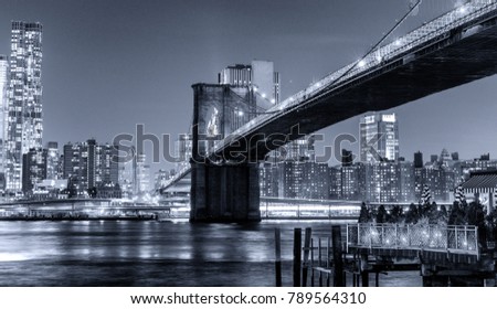 Black and white night view of New York City.