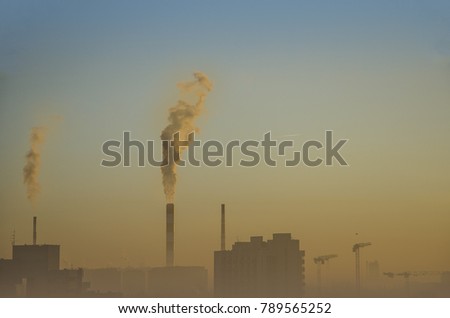 pollution and smog in the city, smoke from the chimneys