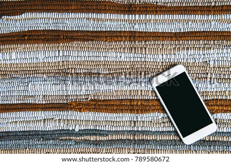 Mobile phone on colorful cloth