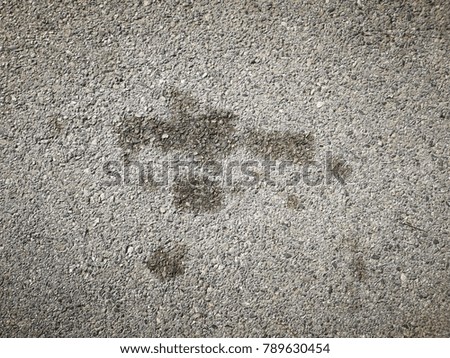 Cement road with oil drops