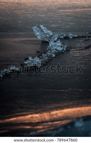 Ice on the beach in sunset