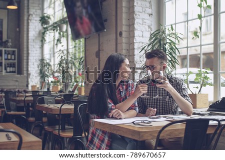 Smiling young couple in cafe