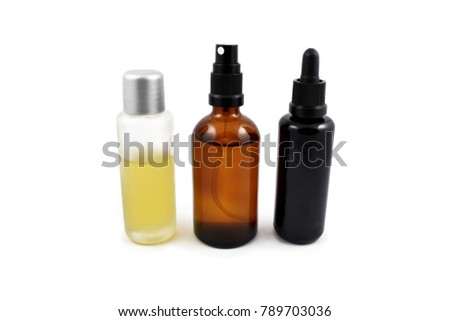 Cosmetic bottle stock images. Brown cosmetic bottle with batcher. Vials on a white background. Glass bottle of oil