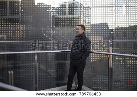 An Asian man resting in a fashion business circle
