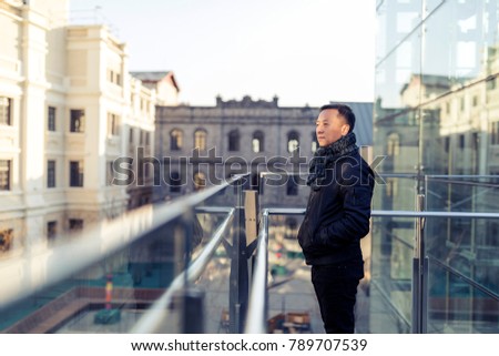 Looking at a distant Asian man in a fashion business circle