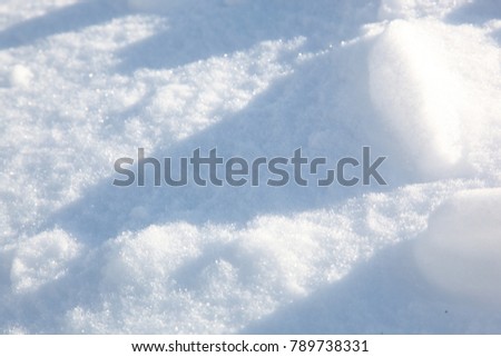white snow drifts with shadows