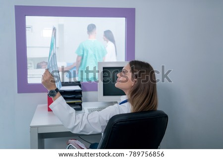 Young doctor examing the radiology picture. concept