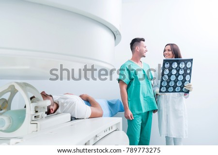Team of doctors looking at radiology picture, concept
