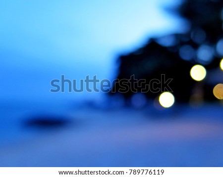 Blurred background of hut on beach with blurry light bokeh, seascape, sea space, blue color,beautiful motion abstract concept  