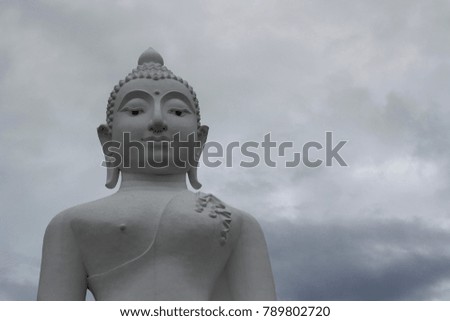 white Buddha stutue in a mountain temple, Pai, Thailand