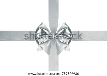 close up of a decorative silver ribbon bow with crosswise ribbons on white background