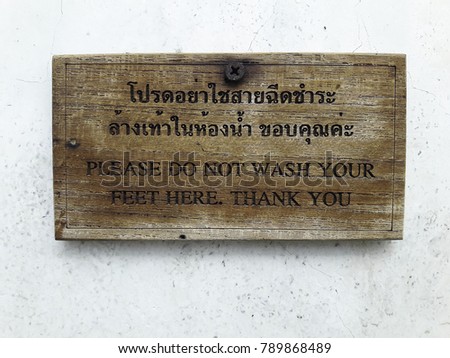 Warning sign in public restroom in Thailand