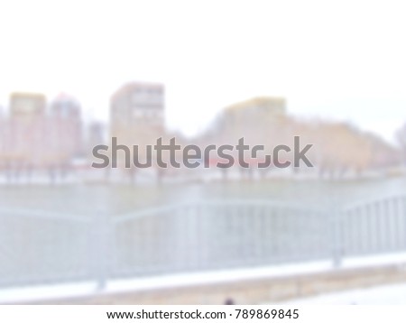 White blur abstract background from nature park with trees mountain buildings and lake