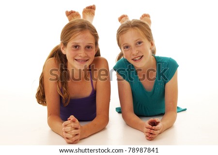 two pretty little girls posing for a picture