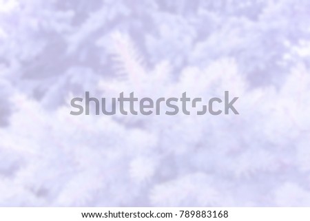 White blur abstract background from nature park with trees hills path and pavements covered with snow in the early spring