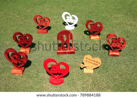 red wooden heart  signs and valentine message in spanish