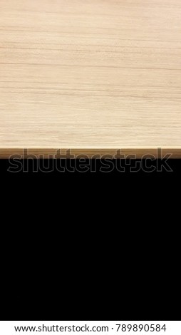 wooden table with black background