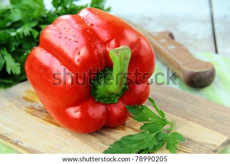 large red bell paprika peppers on a cutting board