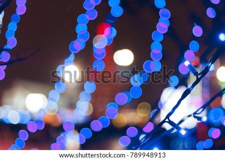 New year garlands near the road Blurred background
