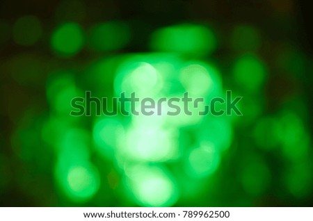 Abstract blurred green background.Circles.Bokeh.Bright light.Celebration.