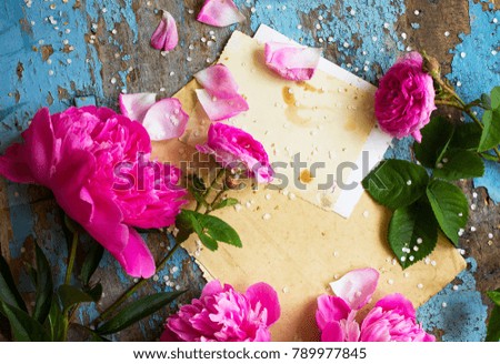 Festive flower composition peony on the blue shabby wooden background. Overhead view. 