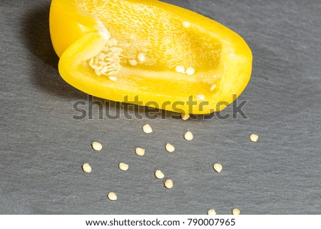 Yellow peppers on black background