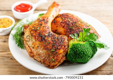 Chicken Legs with Vegetables on wooden table. Royalty-Free Stock Photo #790009231