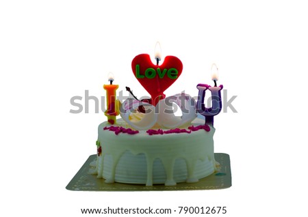 milk cake on white background isolated was decorated by I love you candel wording font,clipping path inside