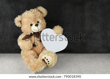 Teddy bear with red hearts wishes you a happy Valentine's day