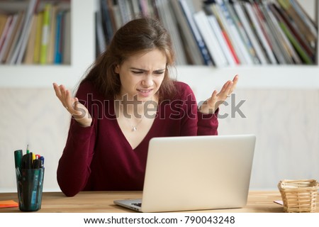 Frustrated annoyed woman confused by computer problem, annoyed businesswoman feels indignant about laptop crash, bad news online or disgusting video on web, stressed student looking at broken pc Royalty-Free Stock Photo #790043248