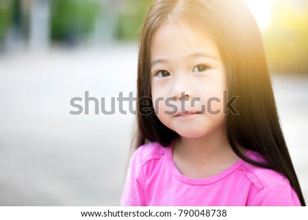 Asian cute little girl, Happy little girl playing in the garden.