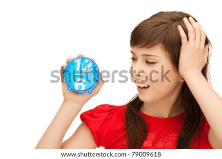 bright picture of teenage girl holding alarm clock