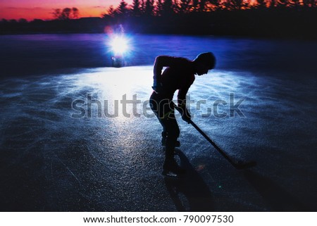 Hockey player silhouette on ice