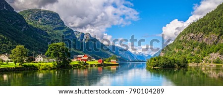 Amazing nature view with fjord and mountains. Beautiful reflection. Location: Scandinavian Mountains, Norway. Artistic picture. Beauty world. The feeling of complete freedom Royalty-Free Stock Photo #790104289