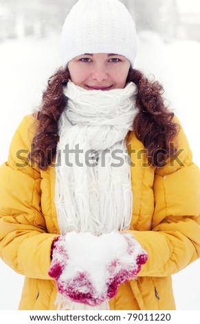 Woman with snow in winter