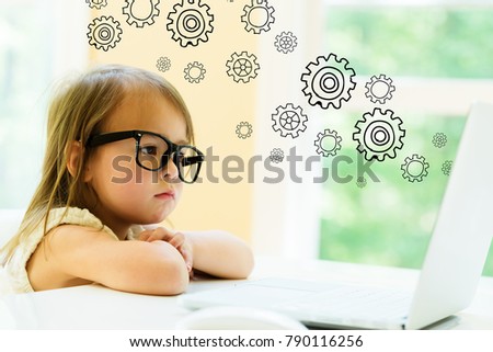 Gears with little girl using her laptop