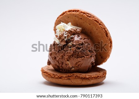 Chocolate ice cream ball with chocolate macaroons. French menu. Restaurant. Royalty-Free Stock Photo #790117393