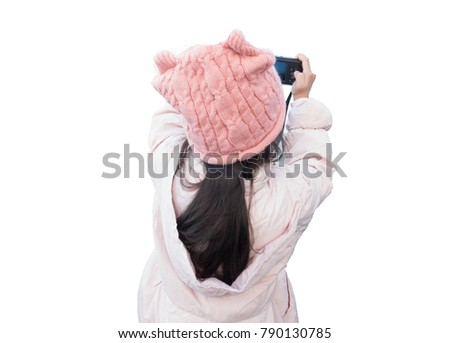 Cute little girl with winter clothes enjoy to take photo,back view, isolated on white, copy space