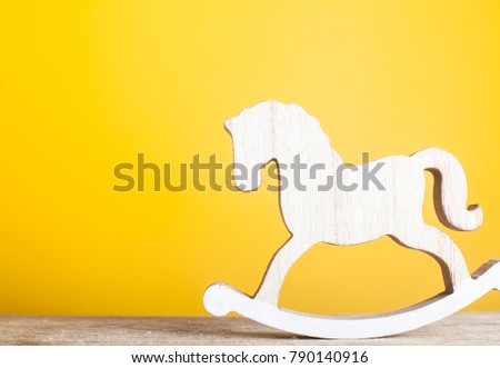 Wooden horse and wooden block stair isolated on white background , concept of unswerving in business or education.
