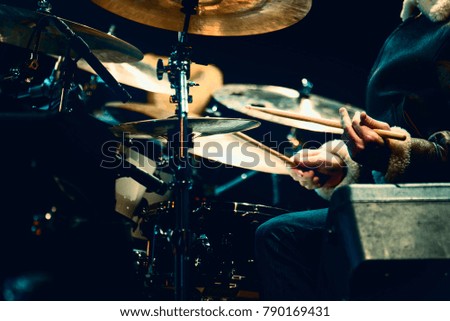 Drummer playing drums on a concert