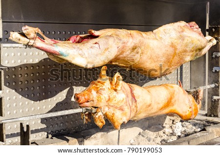 Roasted pig and lamb on the rack in restaurant