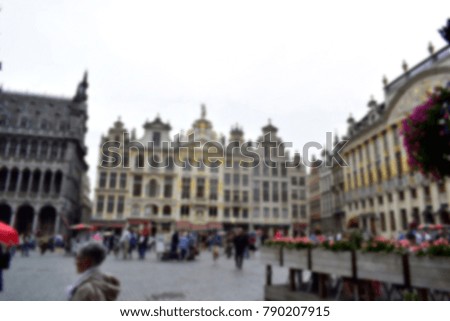 Blurred of tourist walking and enjoy the beauty of Grand Place, it's very beautiful buildings on the main square in Brussels. Grand Place is one of Belgium's most famous of the city. Travel concept