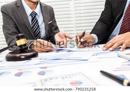 Colleagues are discussing issues related to lawsuits and counseling to fight lawsuits in court. Royalty-Free Stock Photo #790231258