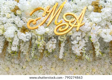 Golden wedding banner on pink flower background with letters M and J representing the love and bridegroom's bride and groom.The day that there is love., Wedding Concepts, Wedding day