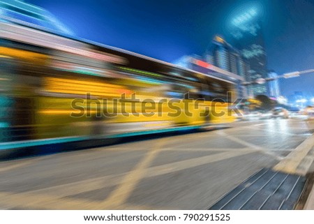 Bus speeding through night street in the city
